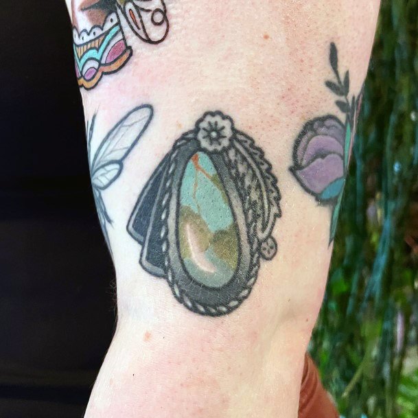 Gemstone Turquoise Tattoo On Arm