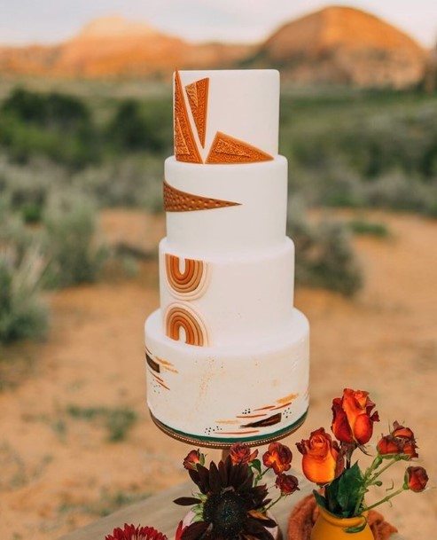 Geometric Orange Designs On Chocolate Wedding Cake