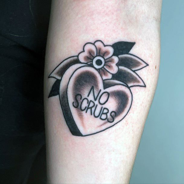 Georgeous Candy Heart Tattoo On Girl