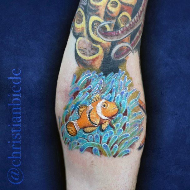 Georgeous Clown Fish Tattoo On Girl