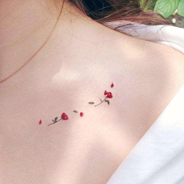 Georgeous Flower Petal Tattoo On Girl