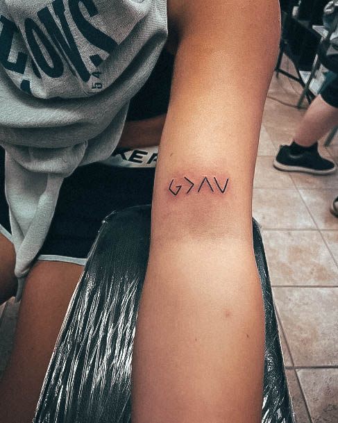 Georgeous God Is Greater Than The Highs And Lows Tattoo On Girl