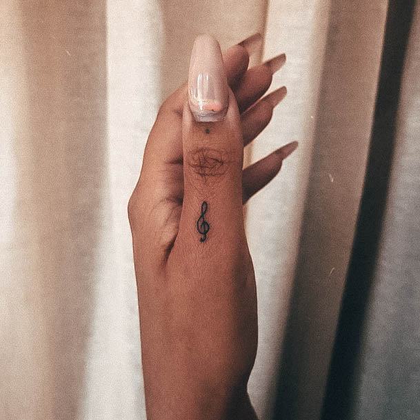 Georgeous Music Note Tattoo On Girl