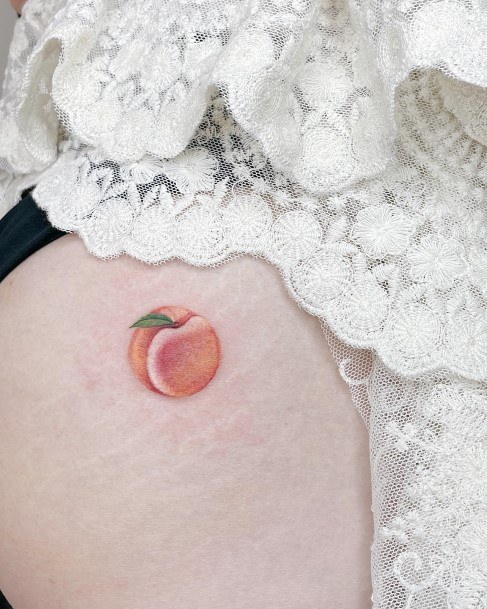 Georgeous Peach Tattoo On Girl