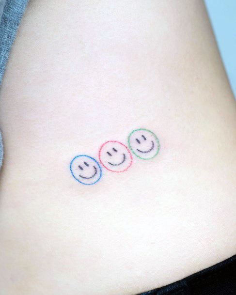 Georgeous Smiley Face Tattoo On Girl