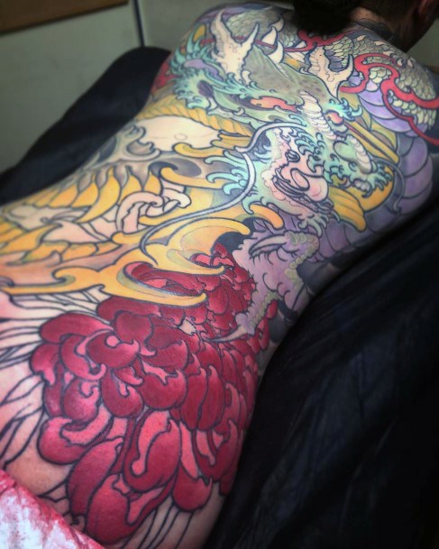 Gigantic And Colored Dragon Tattoo Womens Back