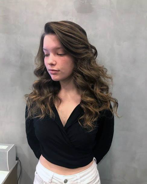 Girl With Chestnut Brown Hair Side Part With Large Volume Curls