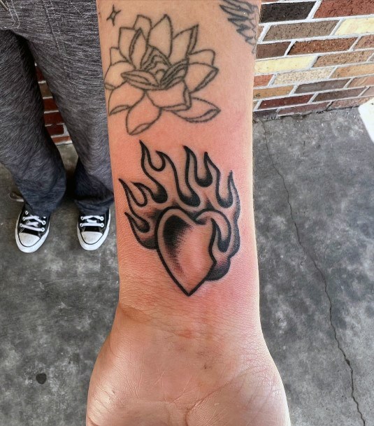 Girl With Darling Flaming Heart Tattoo Design