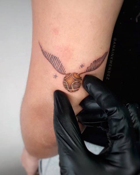 Girl With Darling Golden Snitch Tattoo Design