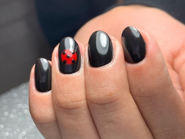 Girl With Darling Ladybug Nail Design