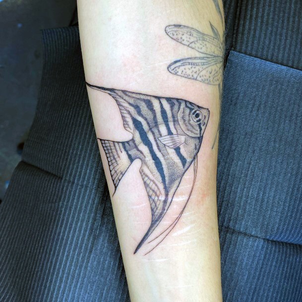 Girl With Feminine Angel Fish Tattoo