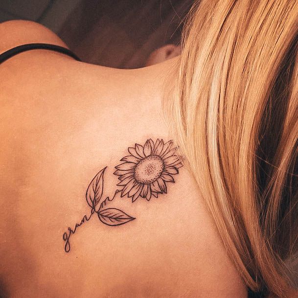 Girl With Feminine Back Of Neck Tattoo