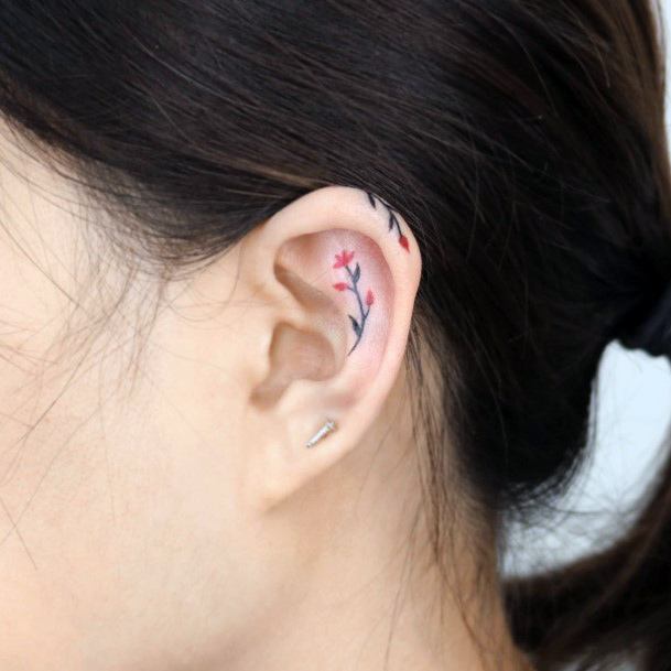 Girl With Feminine Ear Tattoo