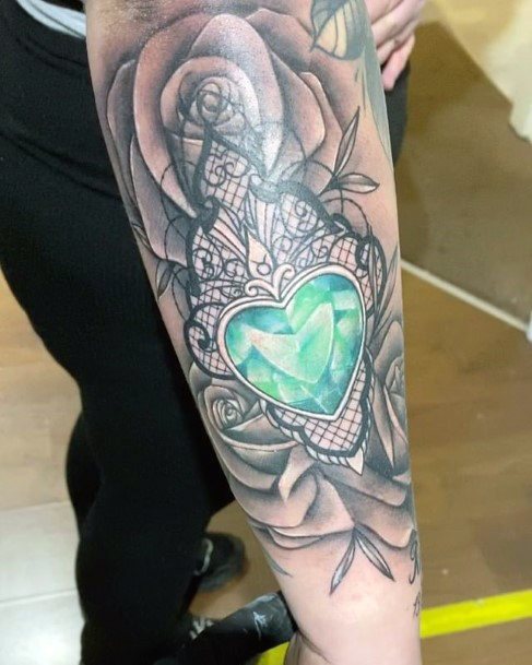 Girl With Feminine Emerald Tattoo