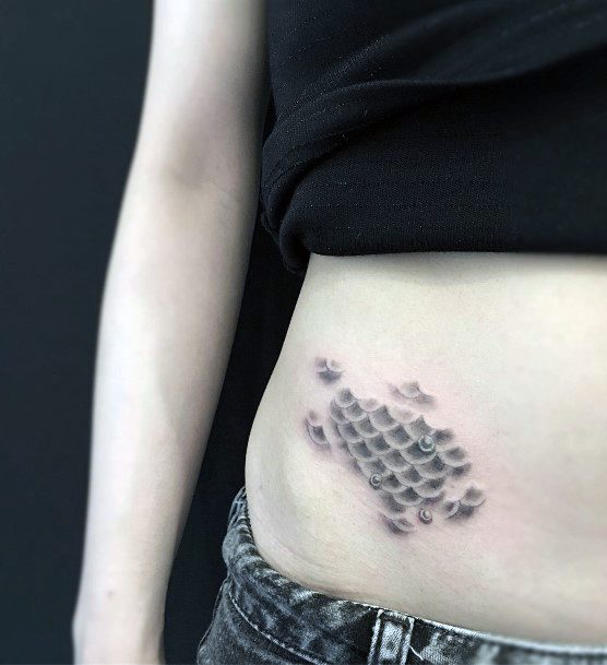 Girl With Feminine Fish Scales Tattoo