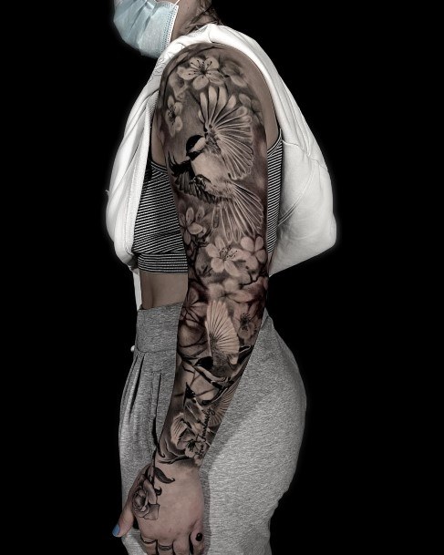 Girl With Feminine Full Sleeve Tattoo