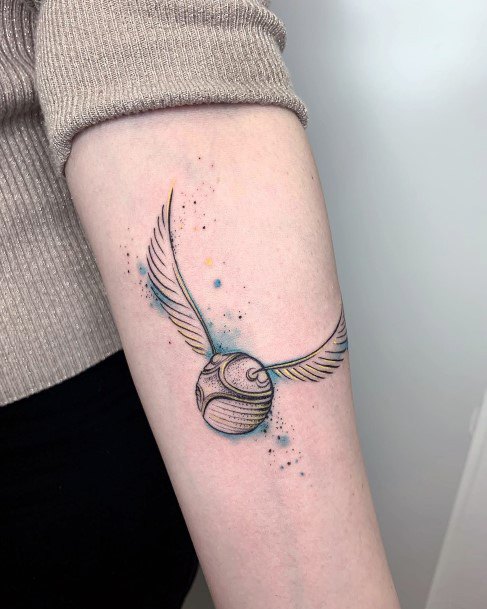 Girl With Feminine Golden Snitch Tattoo