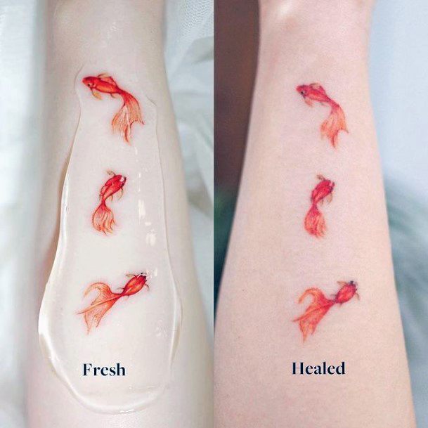 Girl With Feminine Goldfish Tattoo