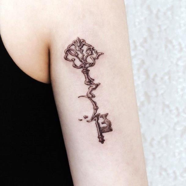 Girl With Feminine Key Tattoo