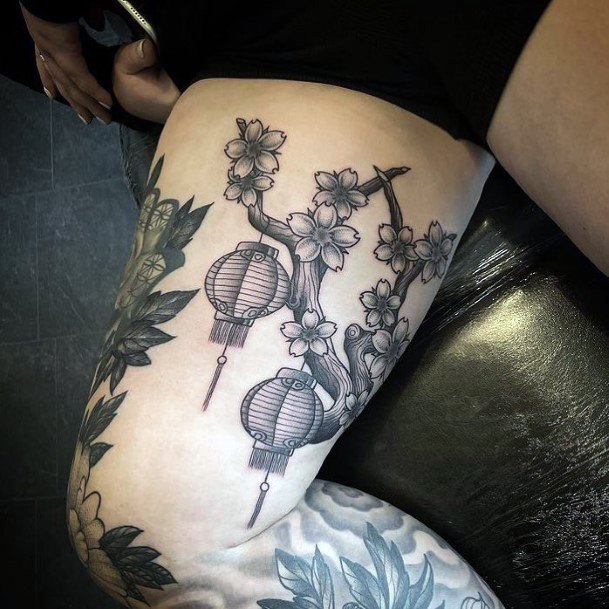 Girl With Feminine Lantern Tattoo