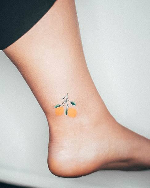 Girl With Feminine Lemon Tattoo