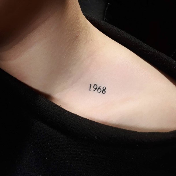 Girl With Feminine Number Tattoo