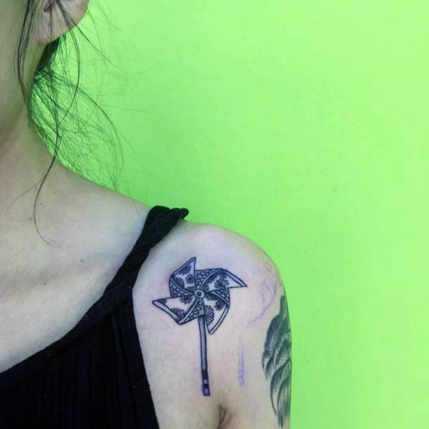 Girl With Feminine Pin Wheel Tattoo