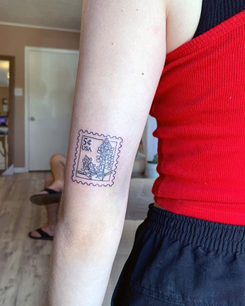 Girl With Feminine Postage Stamp Tattoo