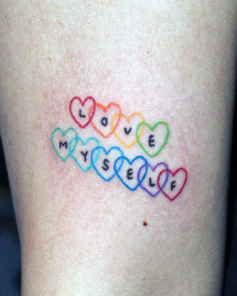 Girl With Feminine Rainbow Tattoo