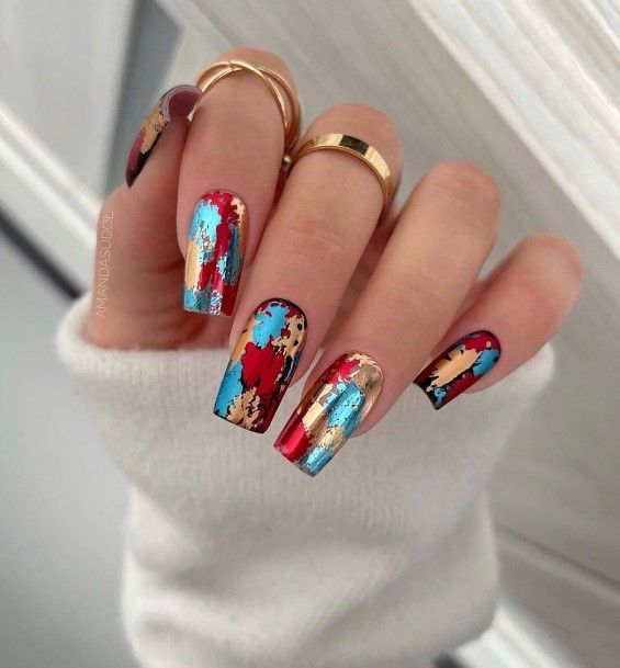Girl With Feminine Red And Blue Nail