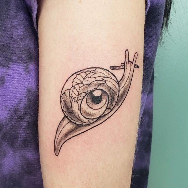 Girl With Feminine Snail Tattoo