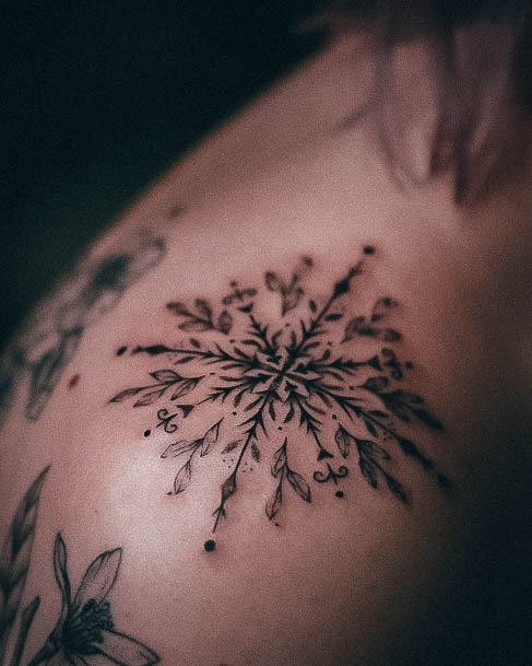 Girl With Feminine Snowflake Tattoo