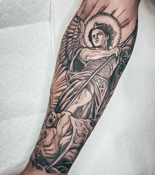 Girl With Feminine St Michael Tattoo