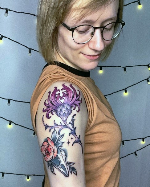 Girl With Feminine Thistle Tattoo