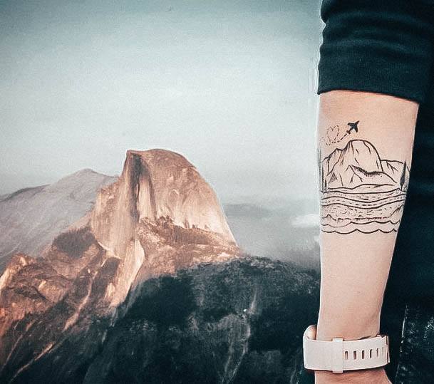 Girl With Feminine Travel Tattoo