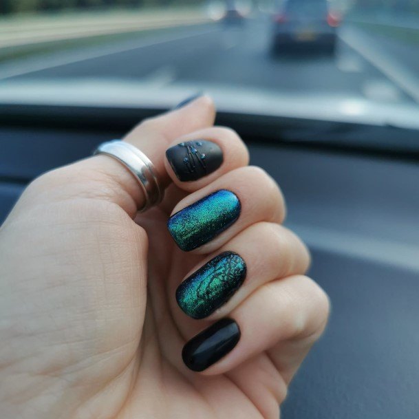 Girl With Graceful Black And Green Nails