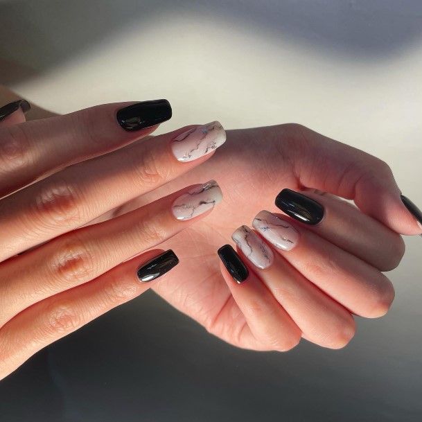 Girl With Graceful Black And White Marble Nails