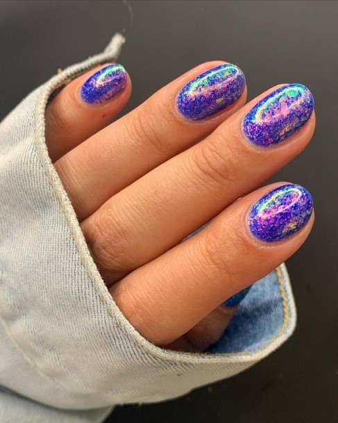 Girl With Graceful Blue Glitter Nails