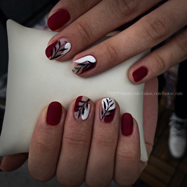 Girl With Graceful Burgundy And Black Nails