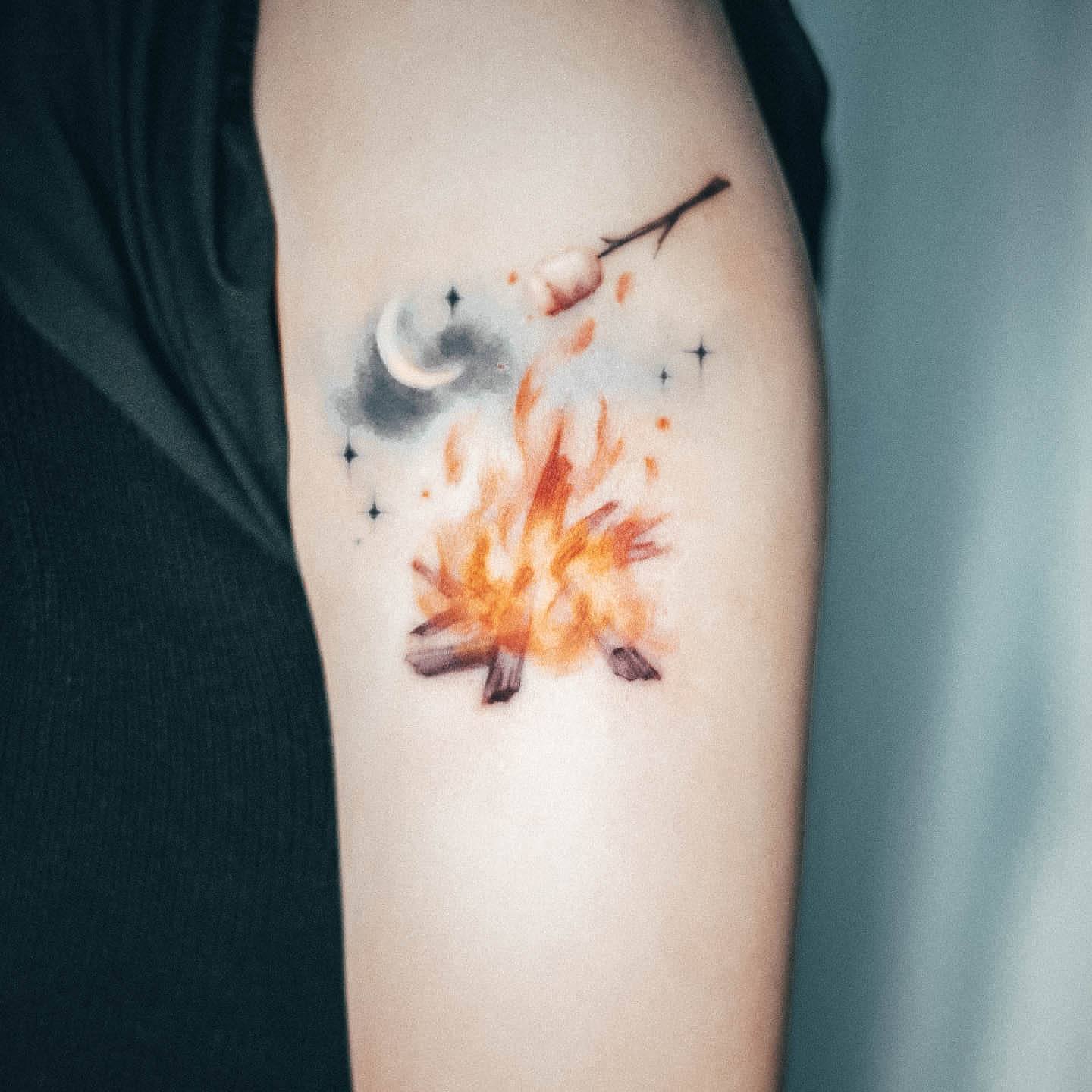 Girl With Graceful Campfire Tattoos