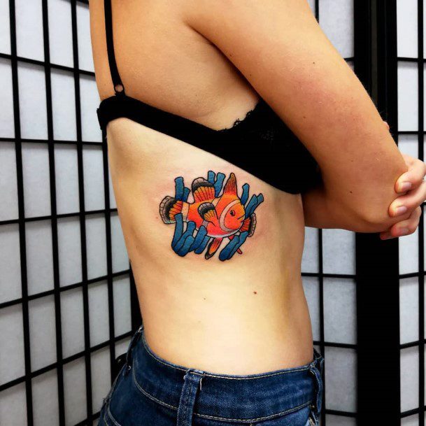 Girl With Graceful Clown Fish Tattoos