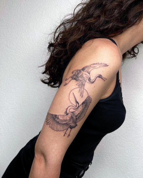 Girl With Graceful Crane Tattoos