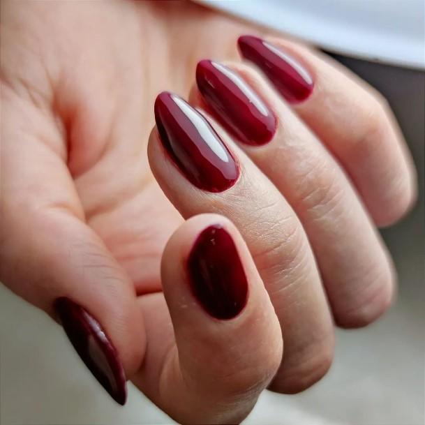 Girl With Graceful Dark Red Nails