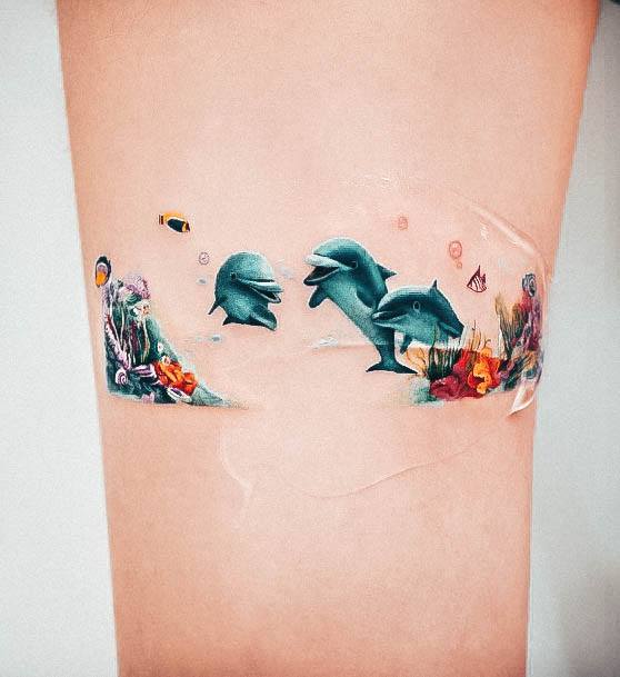 Girl With Graceful Dolphin Tattoos