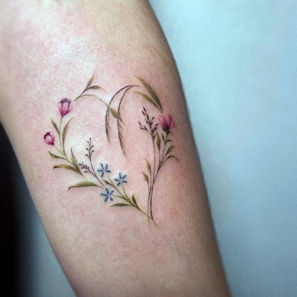 Girl With Graceful Flower Heart Tattoos