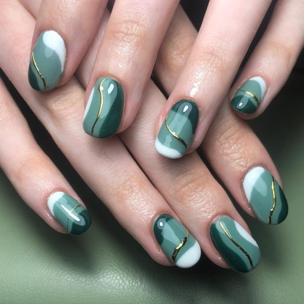 Girl With Graceful Green And White Nails