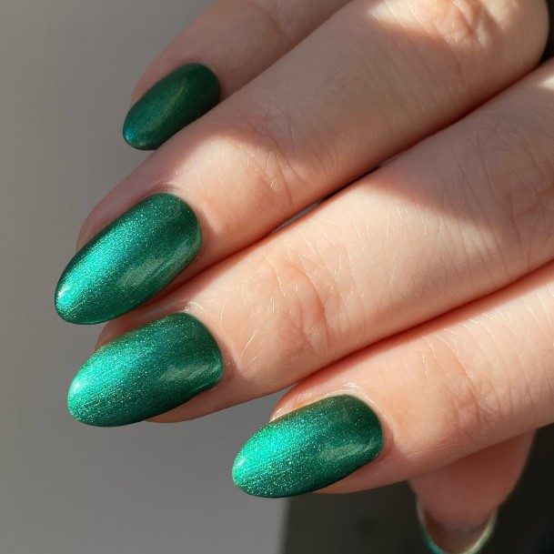 Girl With Graceful Green Glitter Nails