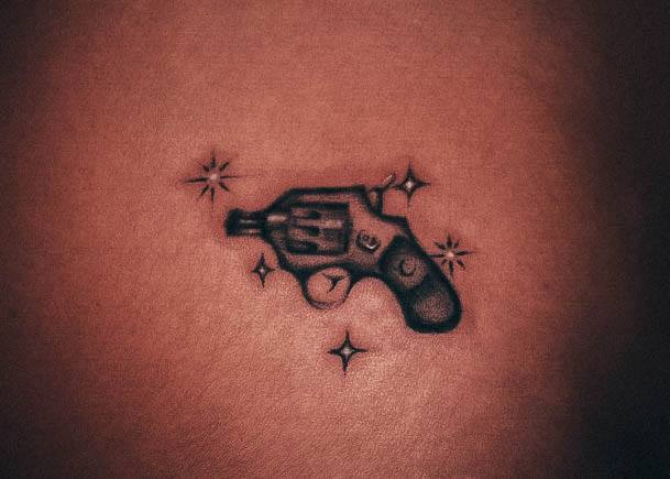 Girl With Graceful Gun Tattoos