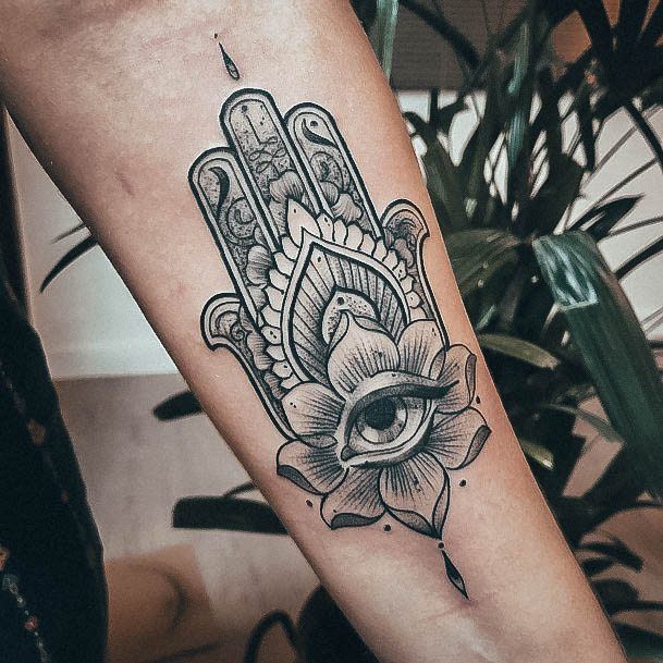 Girl With Graceful Hamsa Tattoos