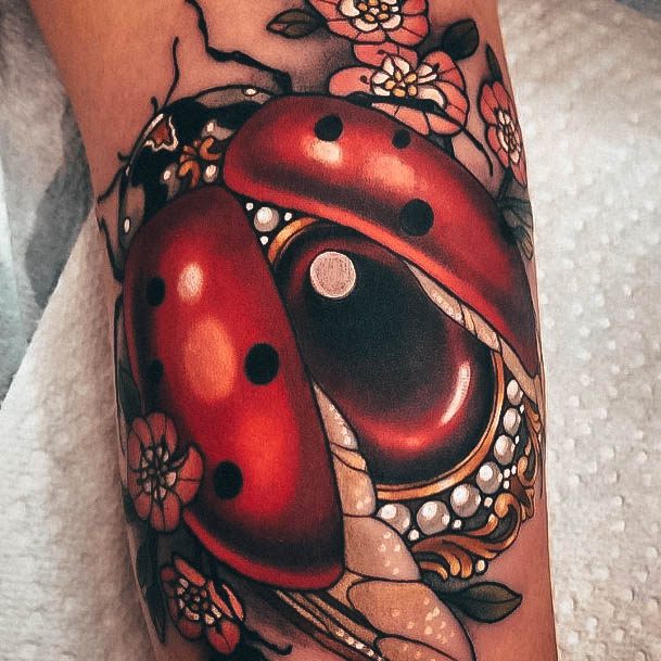 Girl With Graceful Ladybug Tattoos